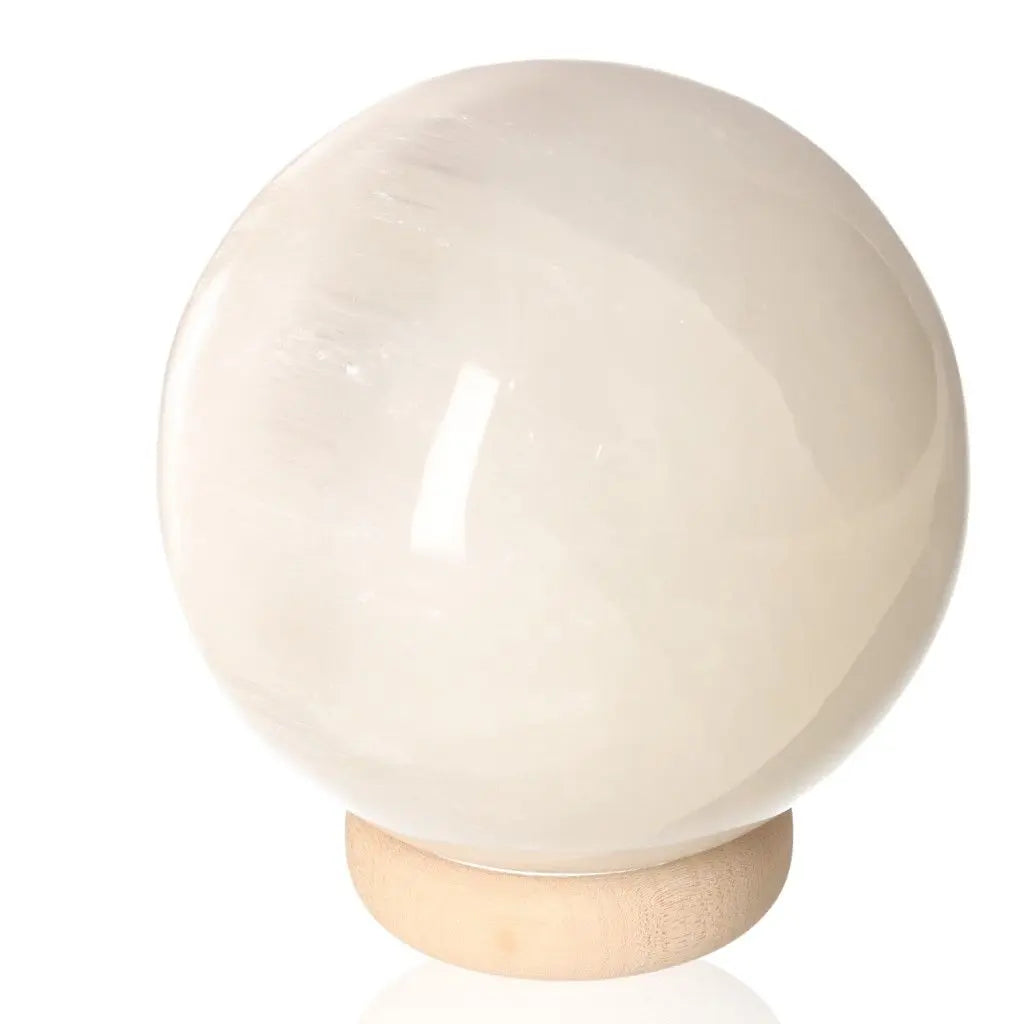 14cm Selenite sphere by Sylvia Crystals, symbolizing purity and power, ideal for spiritual growth and mindful living.