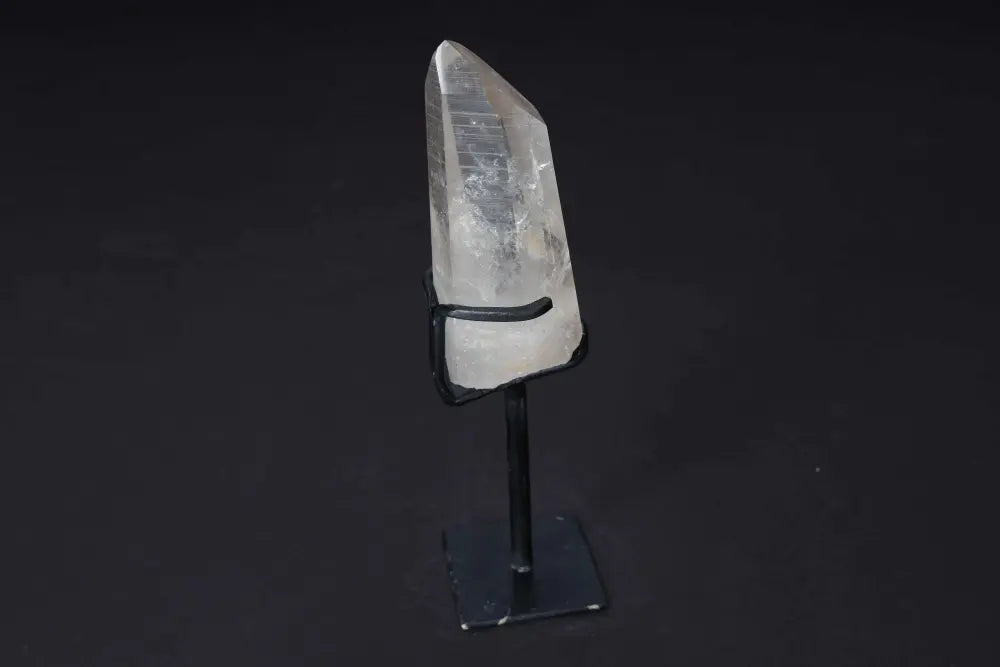Semi-Polished Clear Quartz Point on Stand - Enhance energy and clarity with this elegant and refined centerpiece, perfect for meditation.