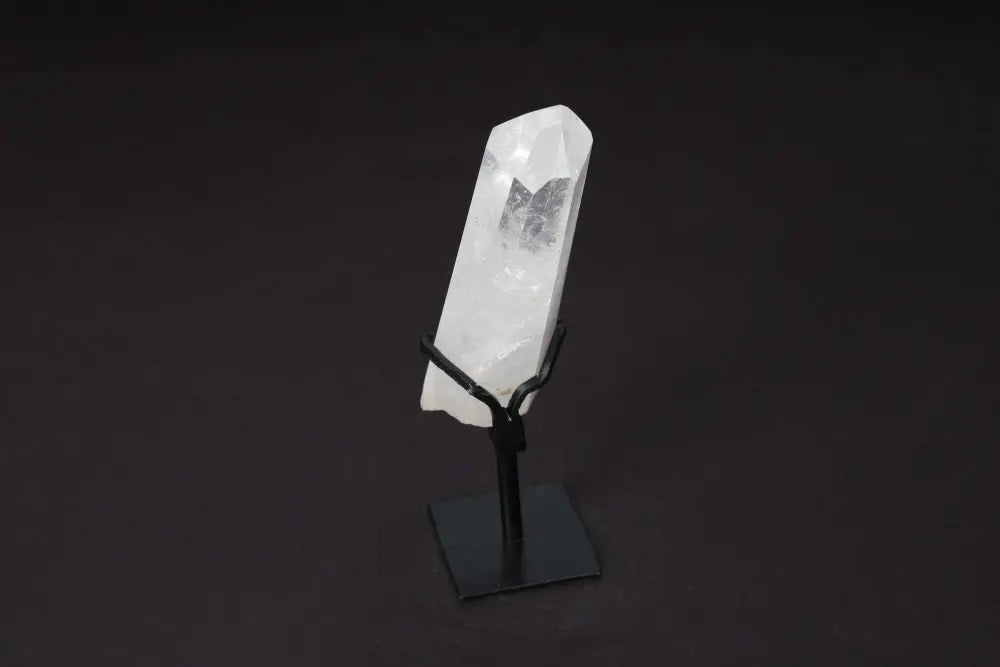 Semi-polished Clear Quartz Point on elegant stand for energy amplification and meditative clarity, ideal for modern decor.