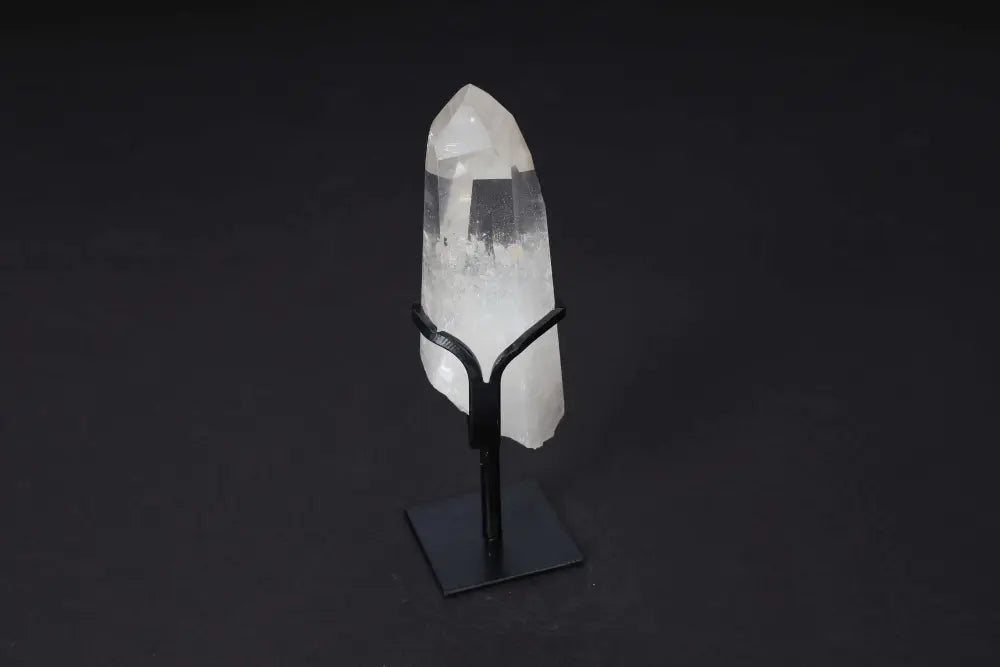 Semi Polished Clear Quartz Point on modern stand for energy alignment and clarity.
