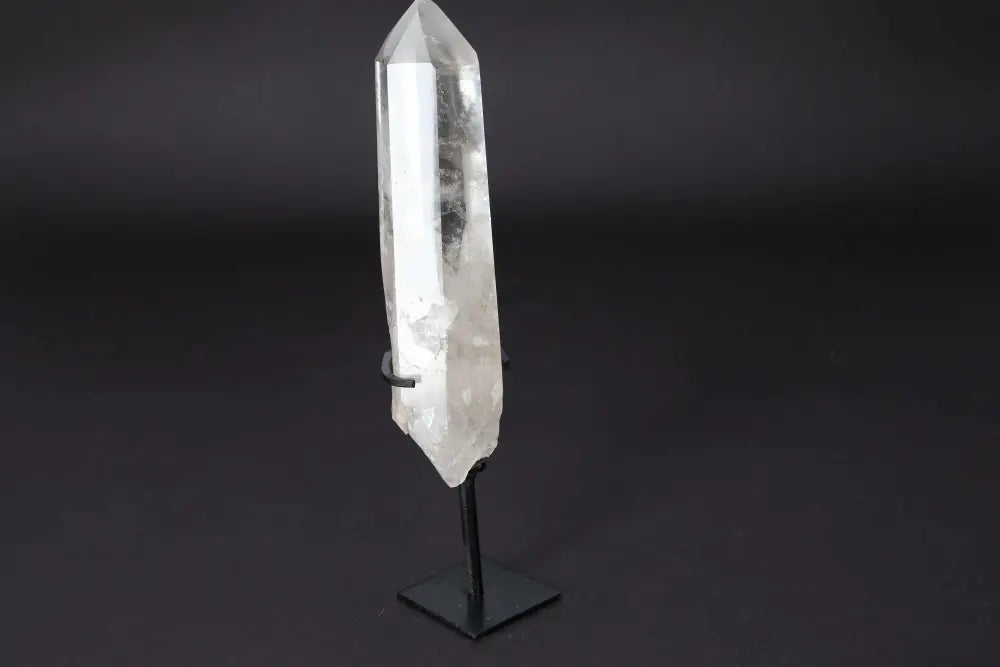 Semi Polished Clear Quartz Point on Stand, ideal for meditation and energy work, amplifying focus and clarity in a modern space.