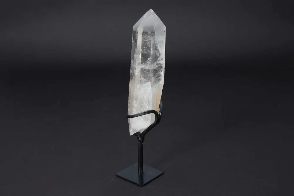 Semi Polished Clear Quartz Point on Stand, amplifying energy and clarity, perfect for meditation and energy work.