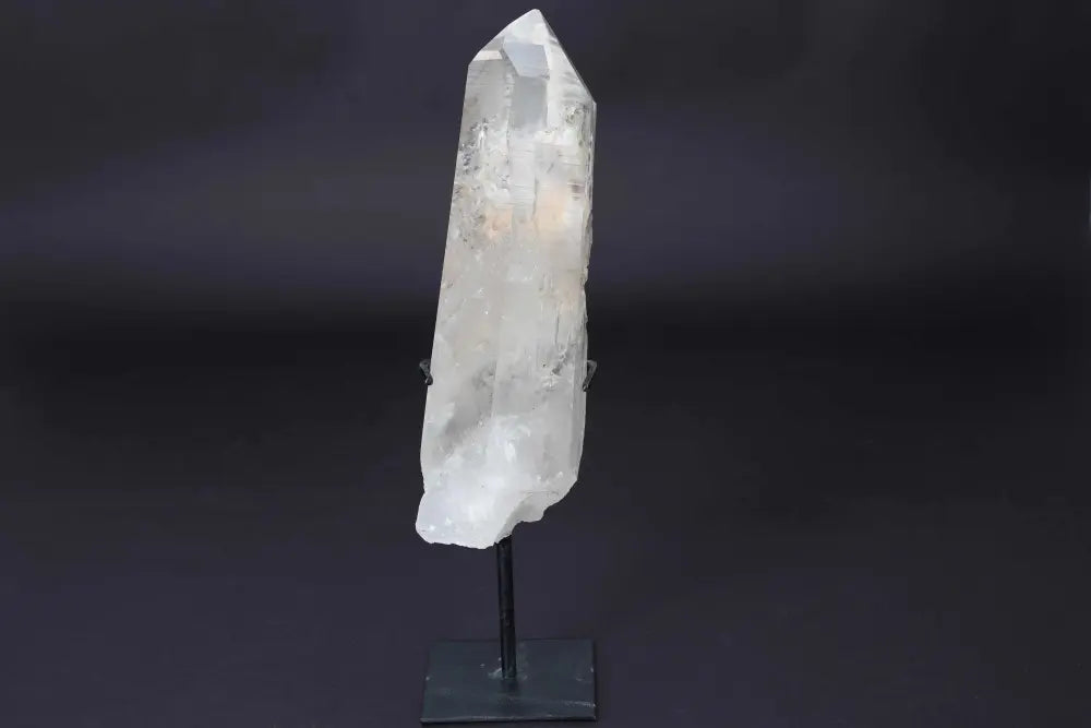 Semi Polished Clear Quartz Point with Stand, amplifies energy and clarity, elegant centerpiece for meditation and energy work.