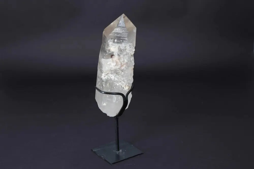 Semi Polished Clear Quartz Point with stand, enhances energy and clarity, ideal for meditation and modern decor.