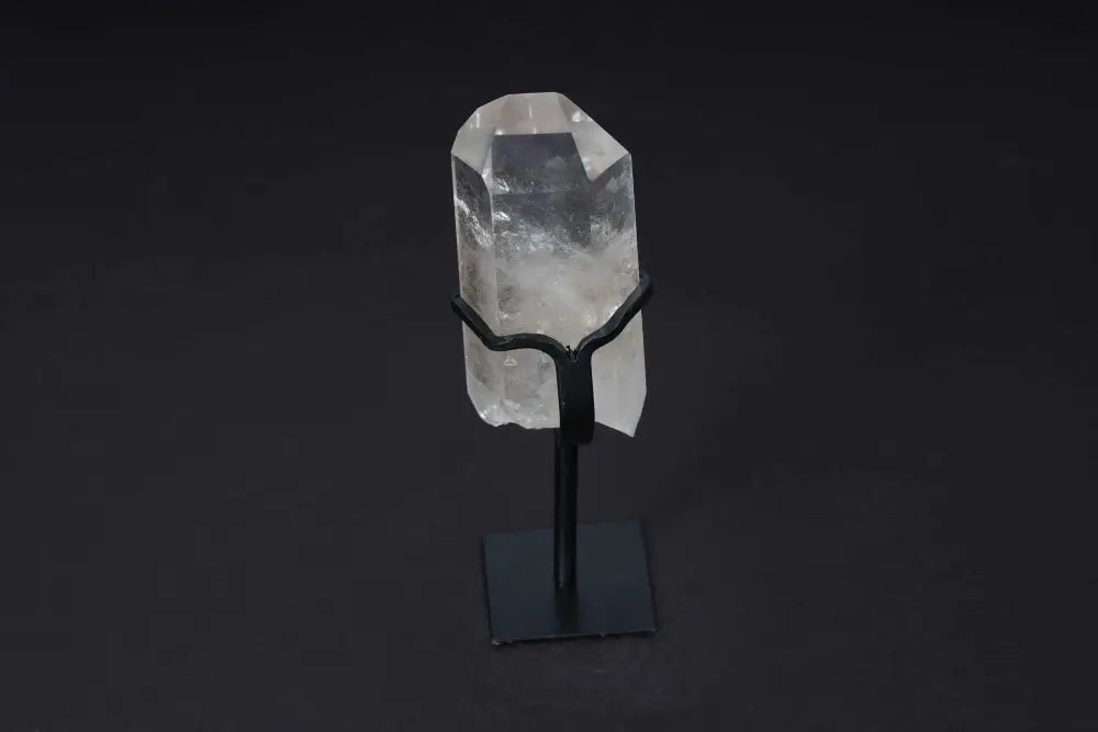 Semi-Polished Smoky Quartz Point on Stand, highlighting earthy tones and elegance, used for grounding and protection.