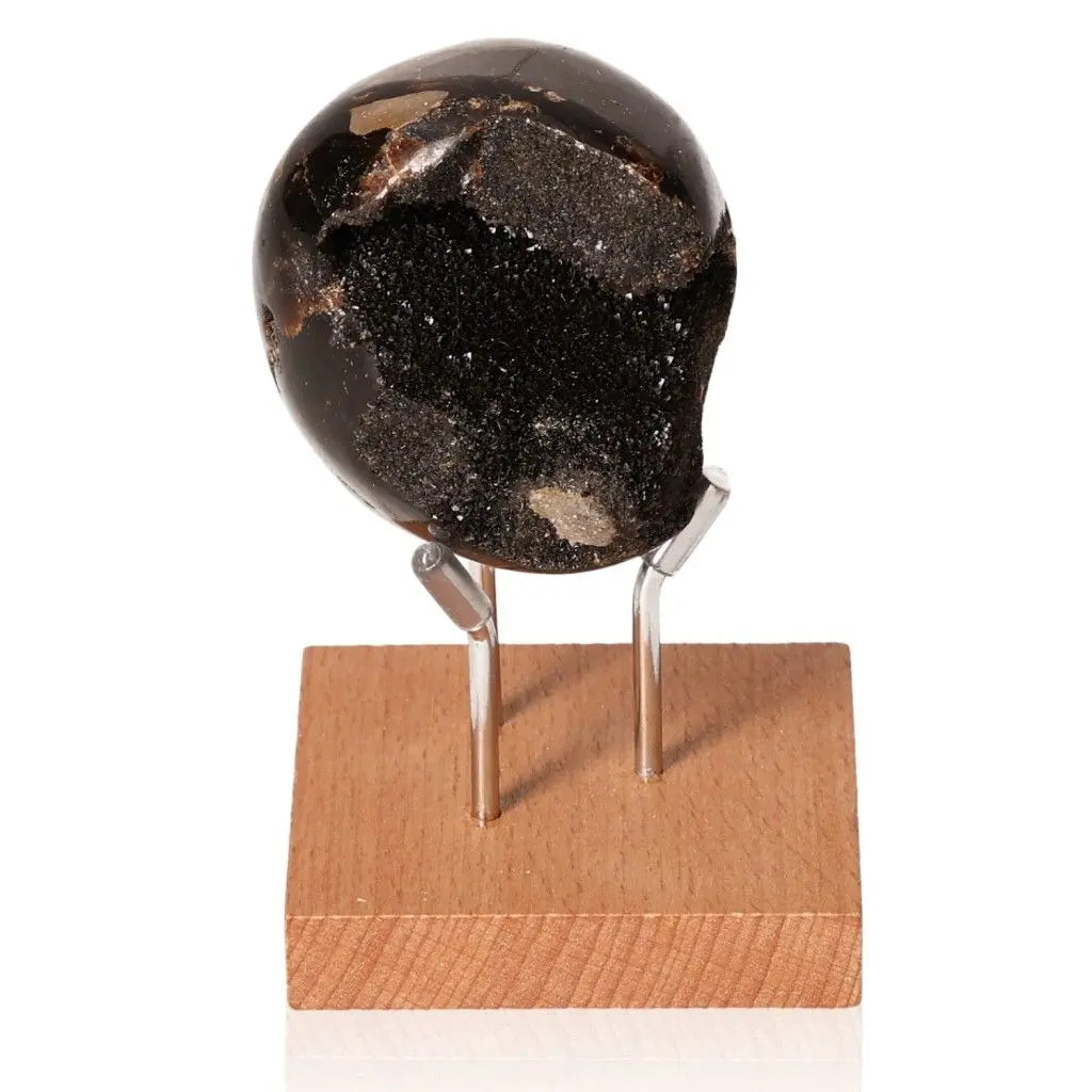 Septarian Dragon Stone on wooden stand showcasing unique patterns and spiritual symbolism for power and endurance.