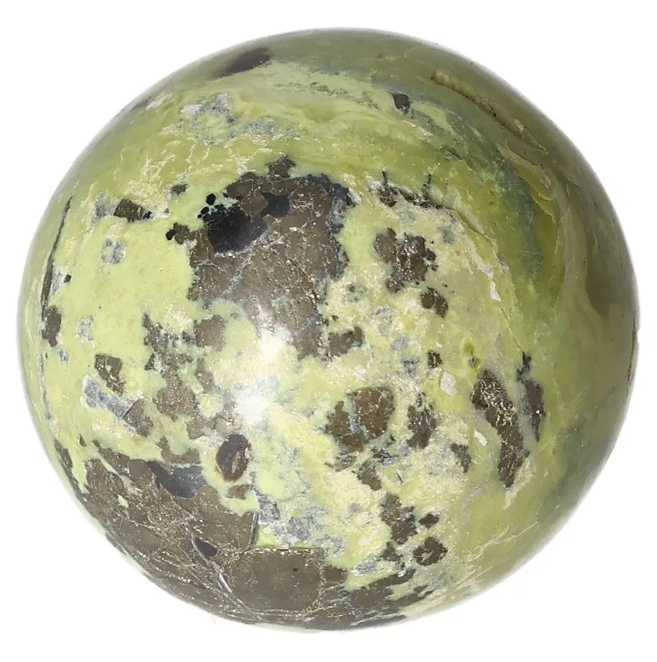 Serpentine sphere for healing, spiritual wisdom, Heart Chakra activation, and meditation, enhances emotional balance and connection to nature.