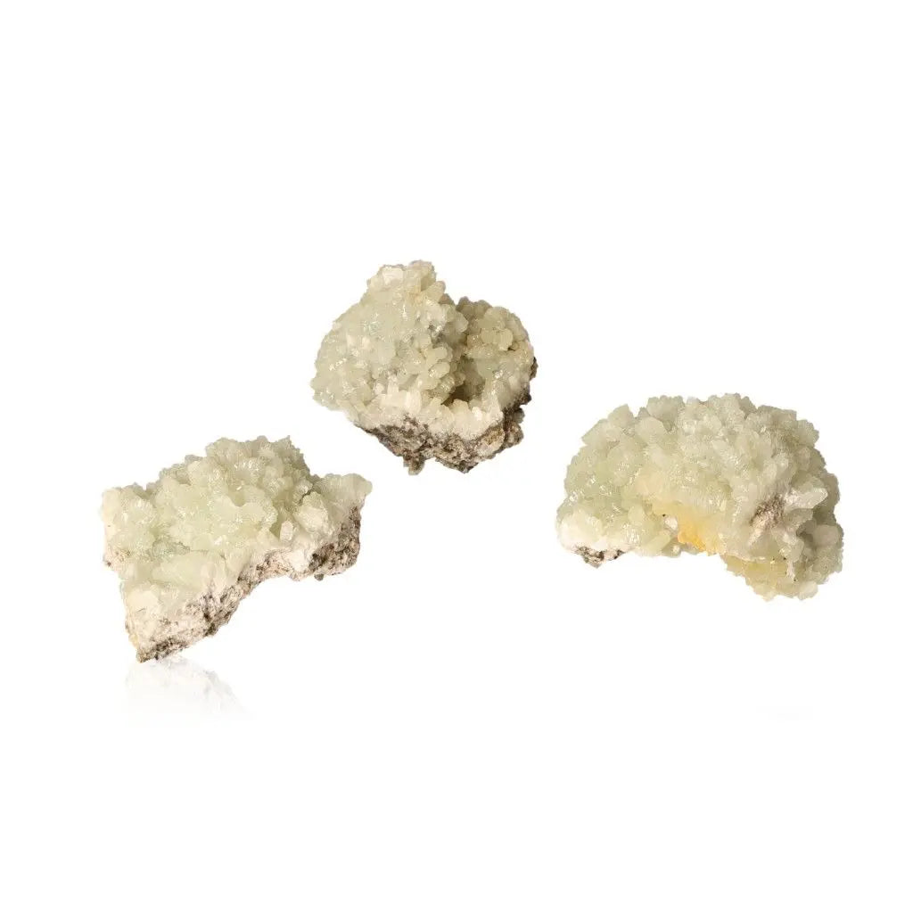 Small Prehnite Druzes with pale green crystals promoting inner peace and spiritual growth, displayed on a white background.