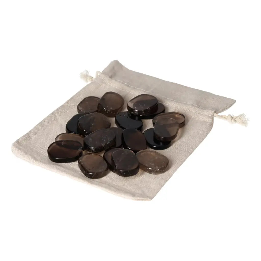 Smoky Quartz Antistress Thumb Massager stones on a canvas bag, perfect for stress relief and spiritual well-being enhancement.