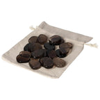 Collection of smoky quartz thumb massagers on a cloth bag, showcasing their natural grounding properties for stress relief.
