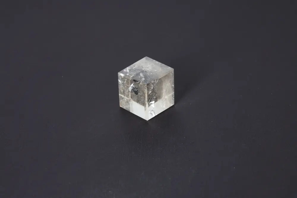 Smoky Quartz Cube 4 cm with grounding energy, offering stability and protection with its translucent gray to earthy brown tones.