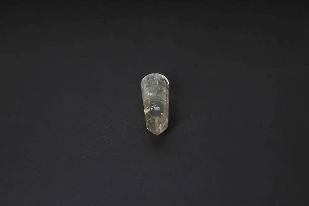 Smoky Quartz Point offering grounding, clarity, and protective energy; polished crystal for emotional balance and negative energy transformation.