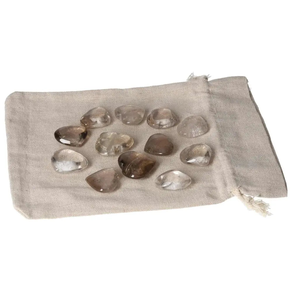 Smoky Quartz small heart-shaped stones on fabric pouch for decision-making, grounding, practical thinking, financial management support.