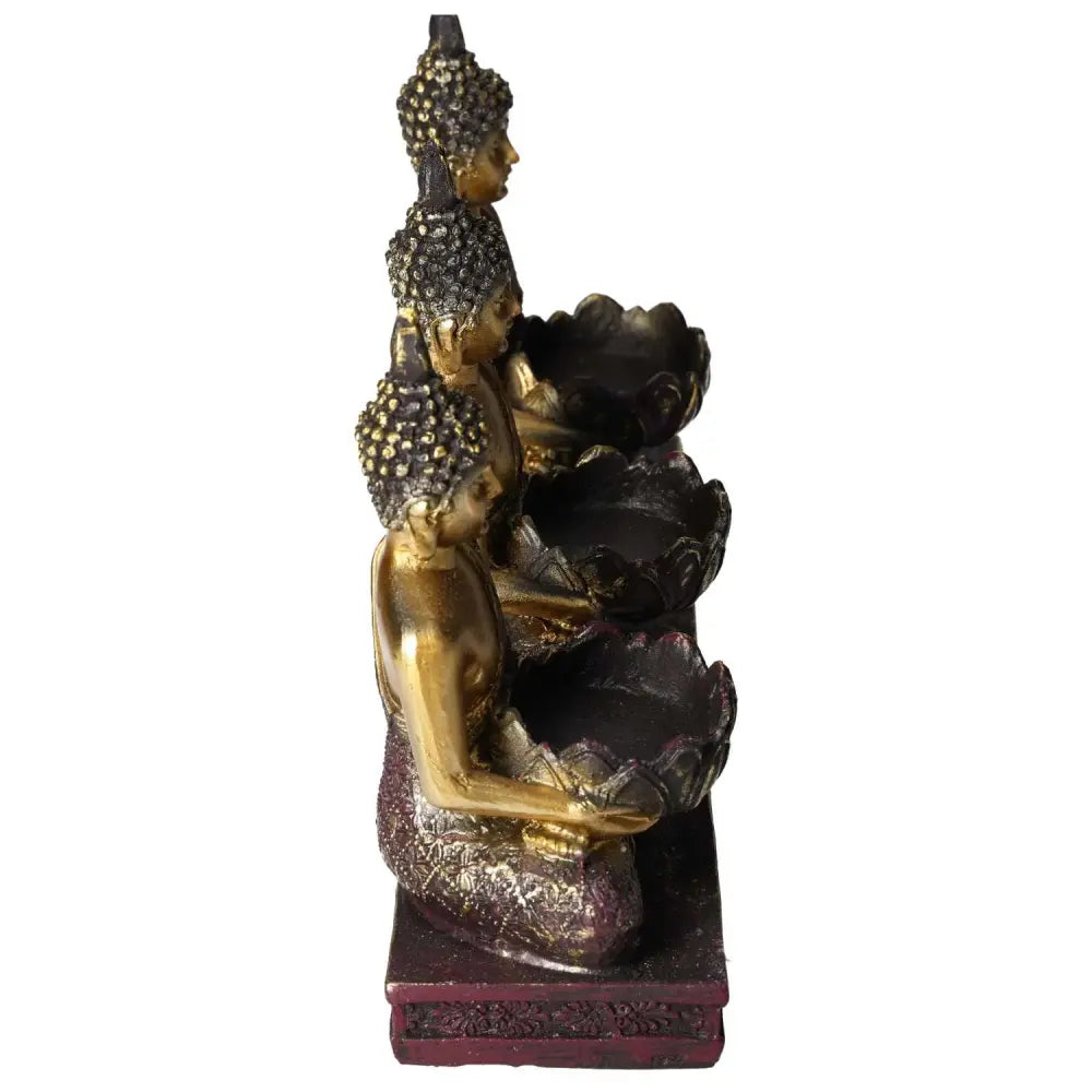 Side view of three Buddha-themed tealight holders with intricate detailing, crafted in gold and brown hues, exuding luxury and spiritual elegance.