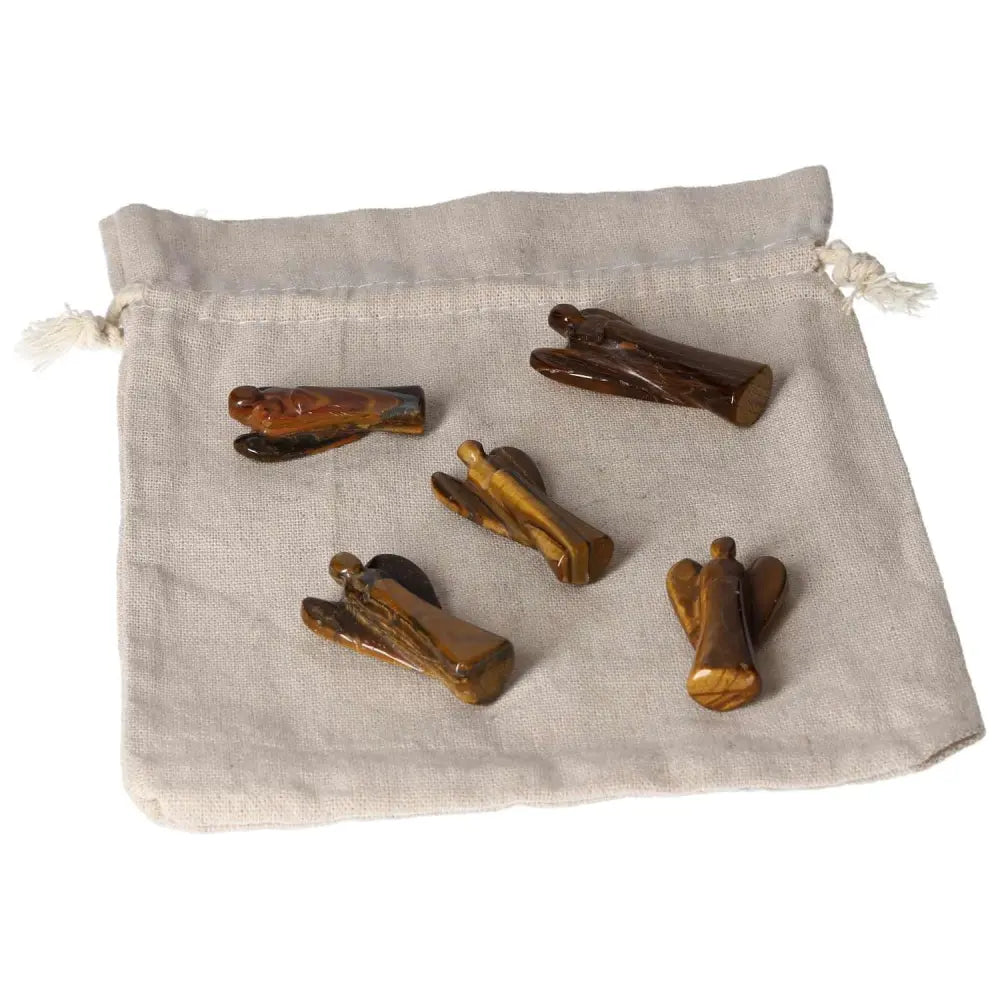Small Tiger's Eye angels on a beige fabric bag, symbolizing protection, strength, and spiritual support with golden-brown shimmer.