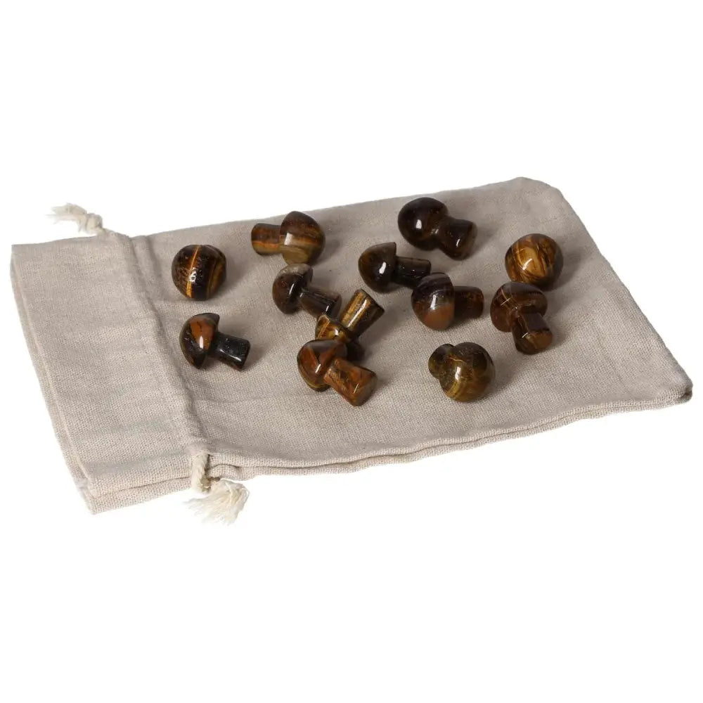 Tiger's Eye small mushroom stones on a beige fabric pouch; enhances mental clarity, focus, and supports wealth management.