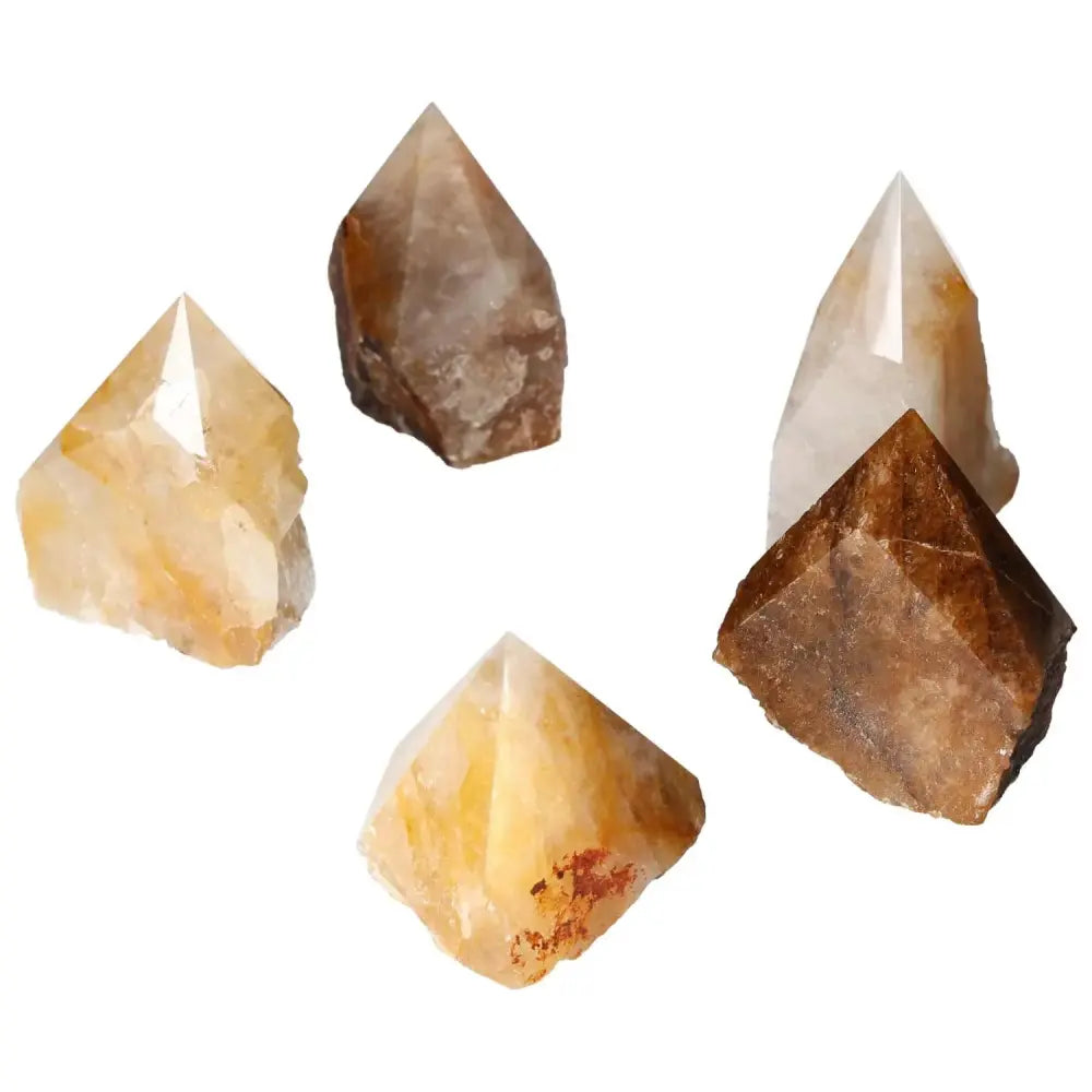 Collection of polished Hematoide crystals with red and orange hues reflecting artisanal craftsmanship and natural beauty from Sylvia Crystals.