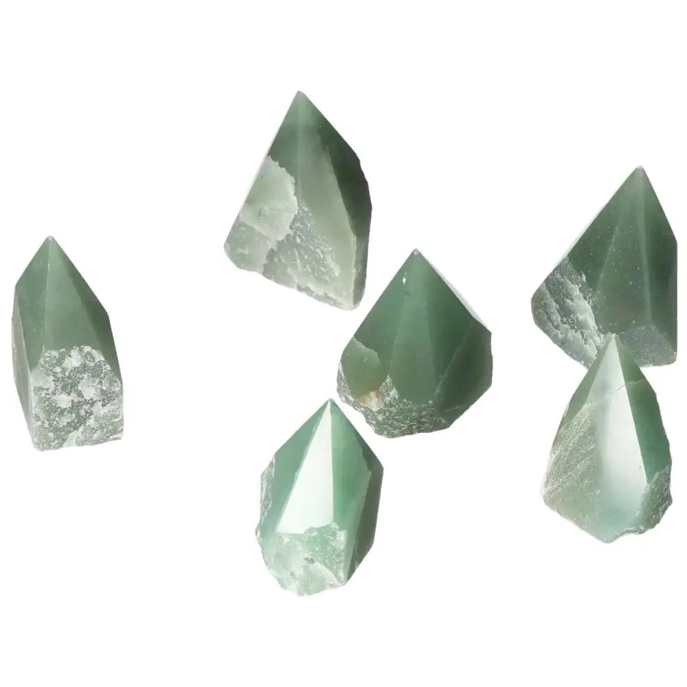 Six top polished point green quartz stones from Sylvia Crystals, showcasing their spiritual and aesthetic elegance.