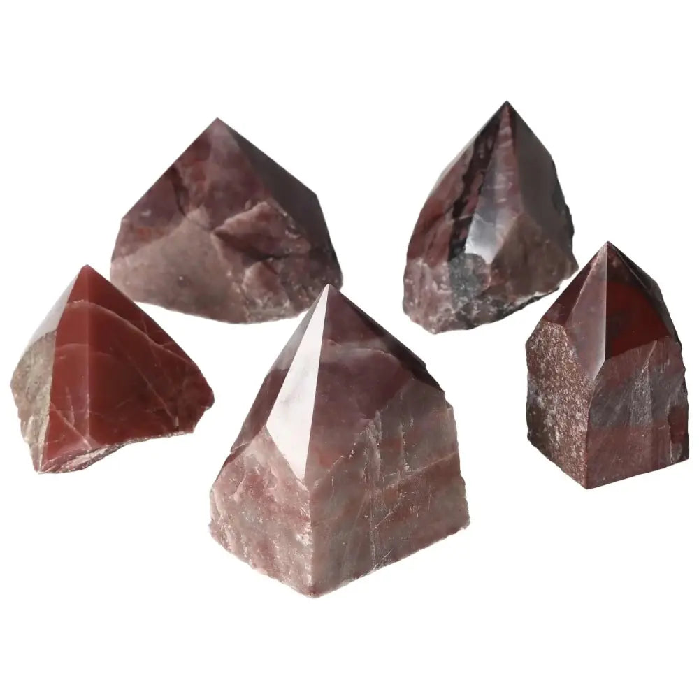 Top Polished Point Guava Quartz M crystals showcasing unique pink hues and premium quality from Sylvia Crystals.