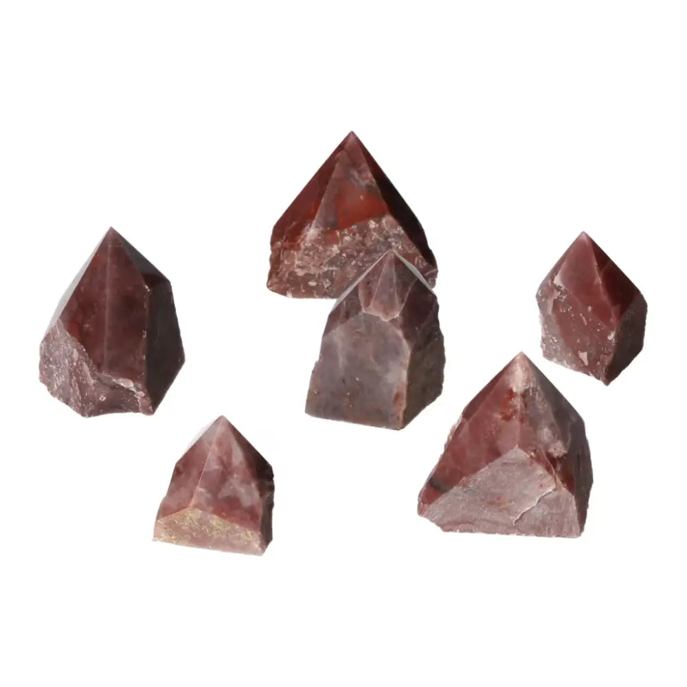 Collection of Top Polished Point Guava Quartz S crystals from Sylvia Crystals, showcasing elegant guava hues and spiritual benefits.