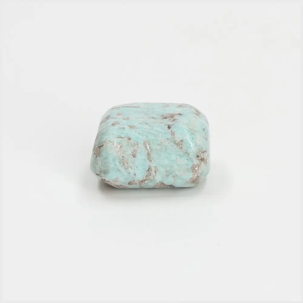 Tumbled Amazonite gemstone with soothing turquoise and green hues, known for promoting emotional balance and truth.