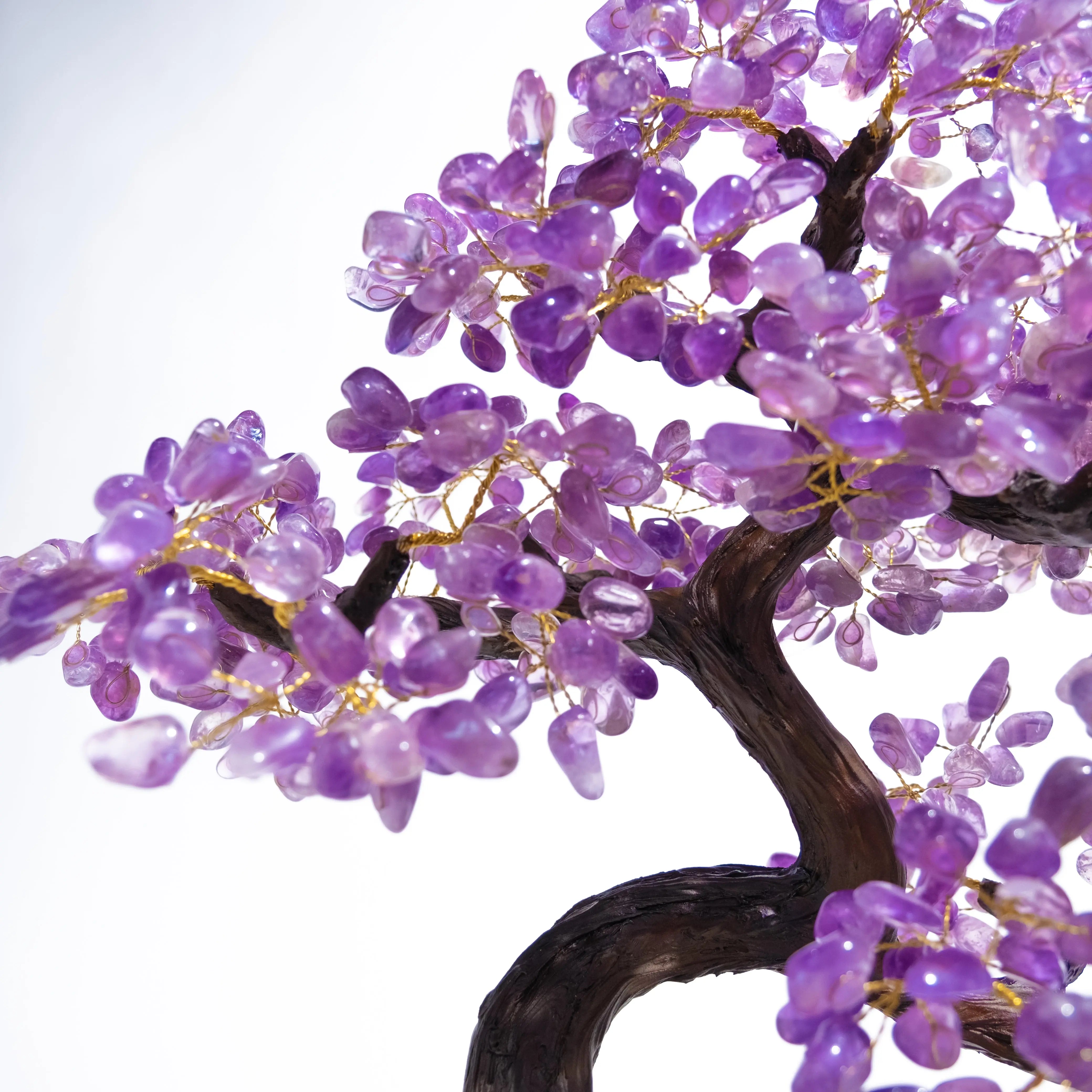 Close-up of a Tumbled Amethyst Crystal Bonsai Tree with purple gemstone leaves, radiating calming and protective energy.