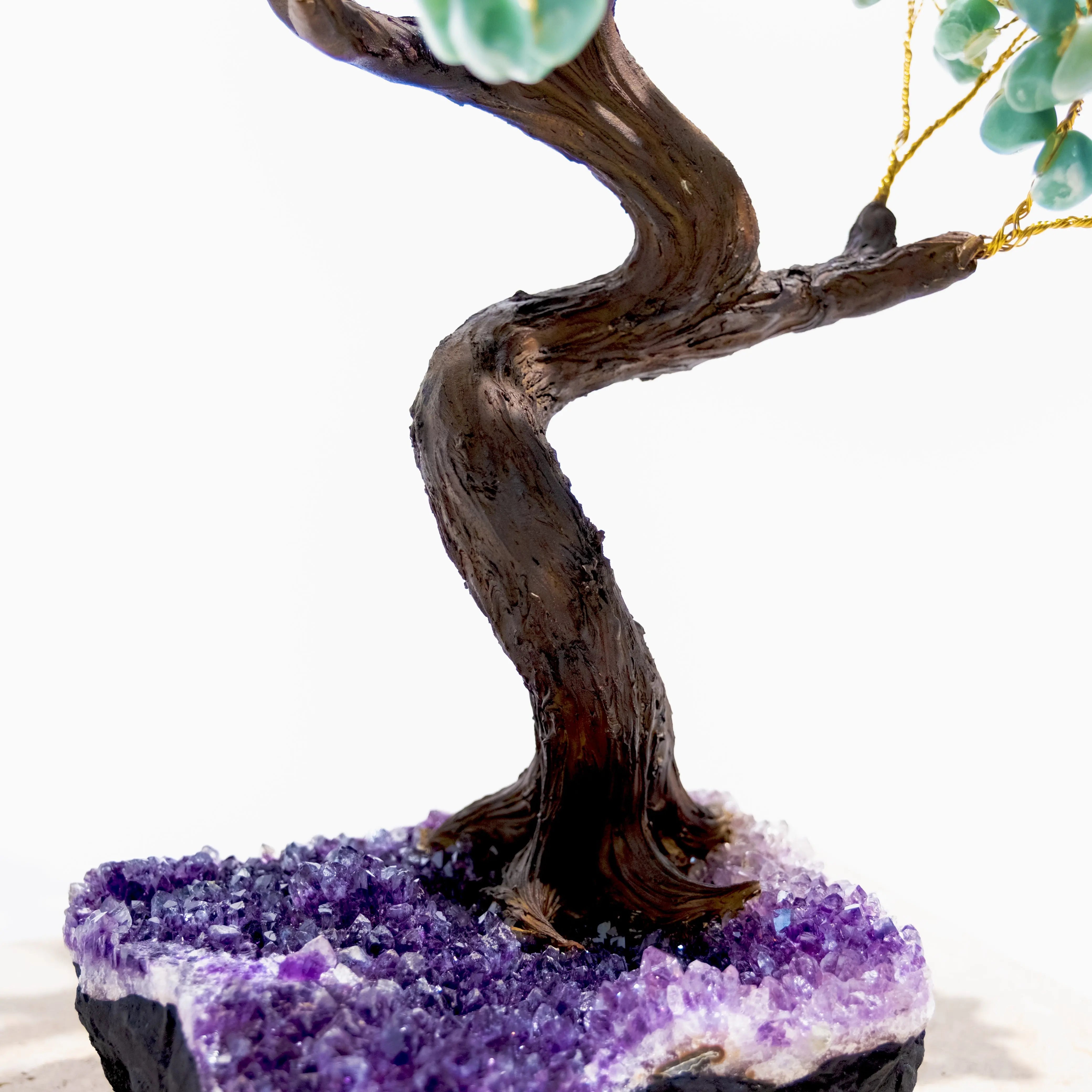 Close-up of a handcrafted Tumbled Aventurine Bonsai Tree on an amethyst base, symbolizing prosperity and positive energy.
