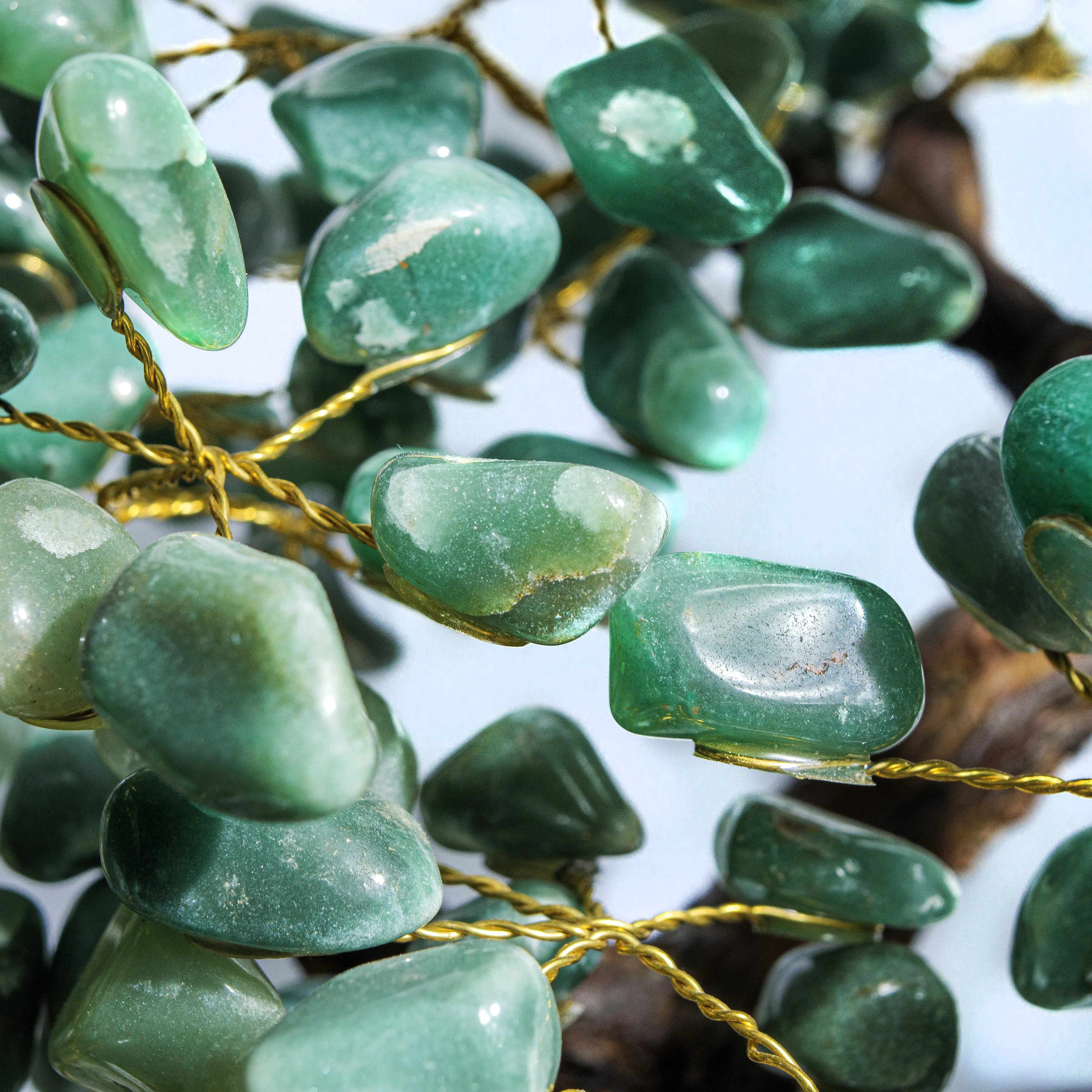 Close-up of a handcrafted Tumbled Aventurine Crystal Bonsai Tree, showcasing vibrant green stones for prosperity and positive energy.