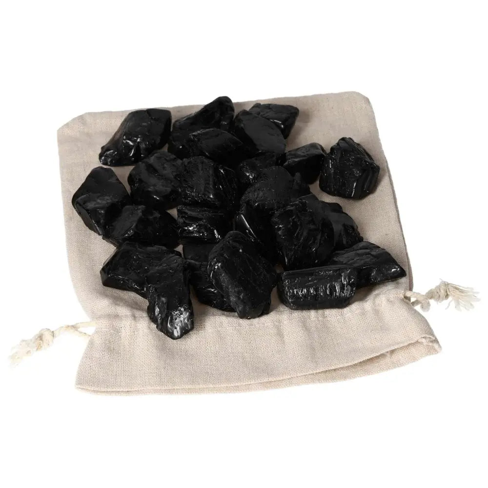 Tumbled Black Tourmaline L crystals on cloth bag for cleansing and grounding, by Sylvia Crystals.