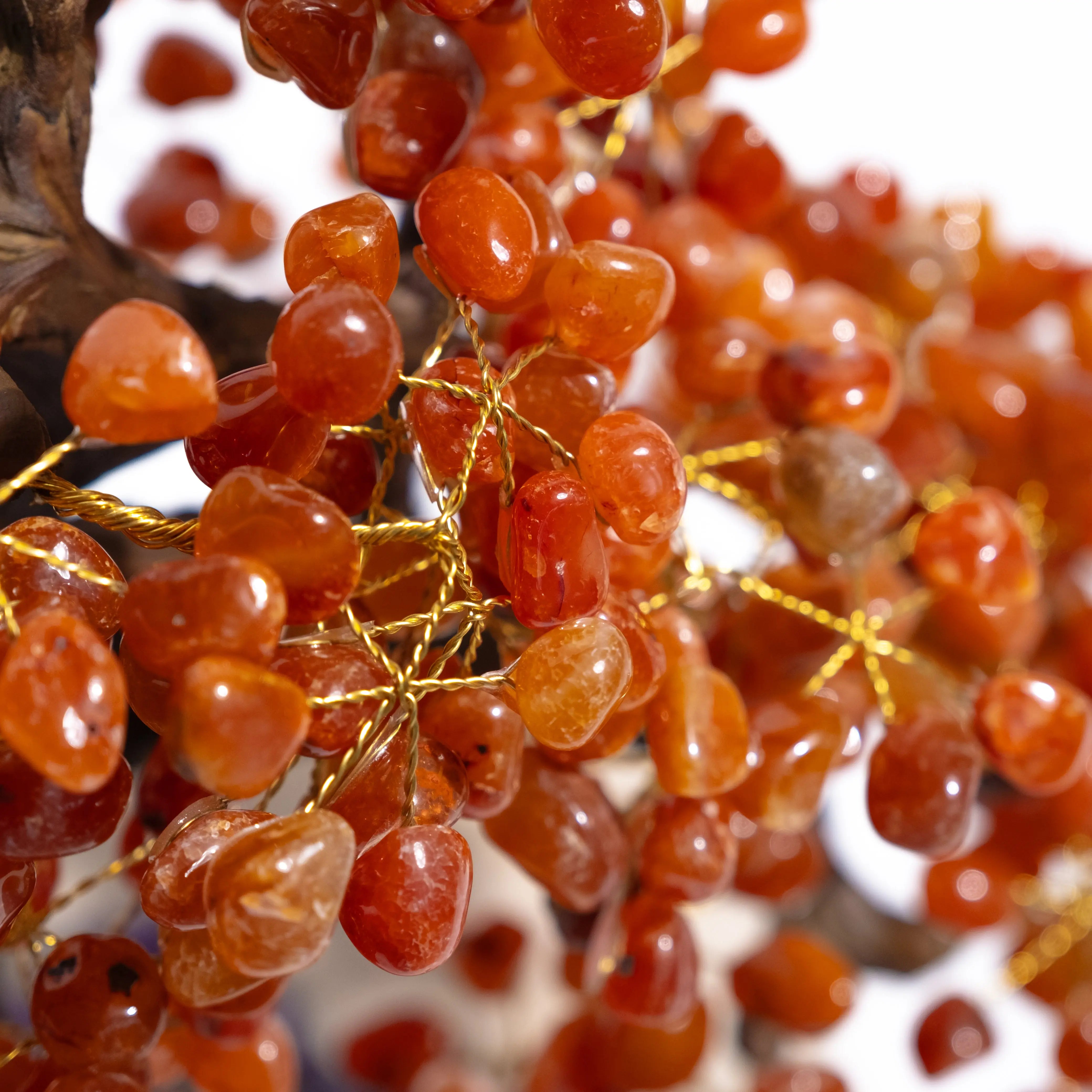 Close-up of a handcrafted Tumbled Carnelian Bonsai Tree with polished gemstones, symbolizing creativity and positive energy.