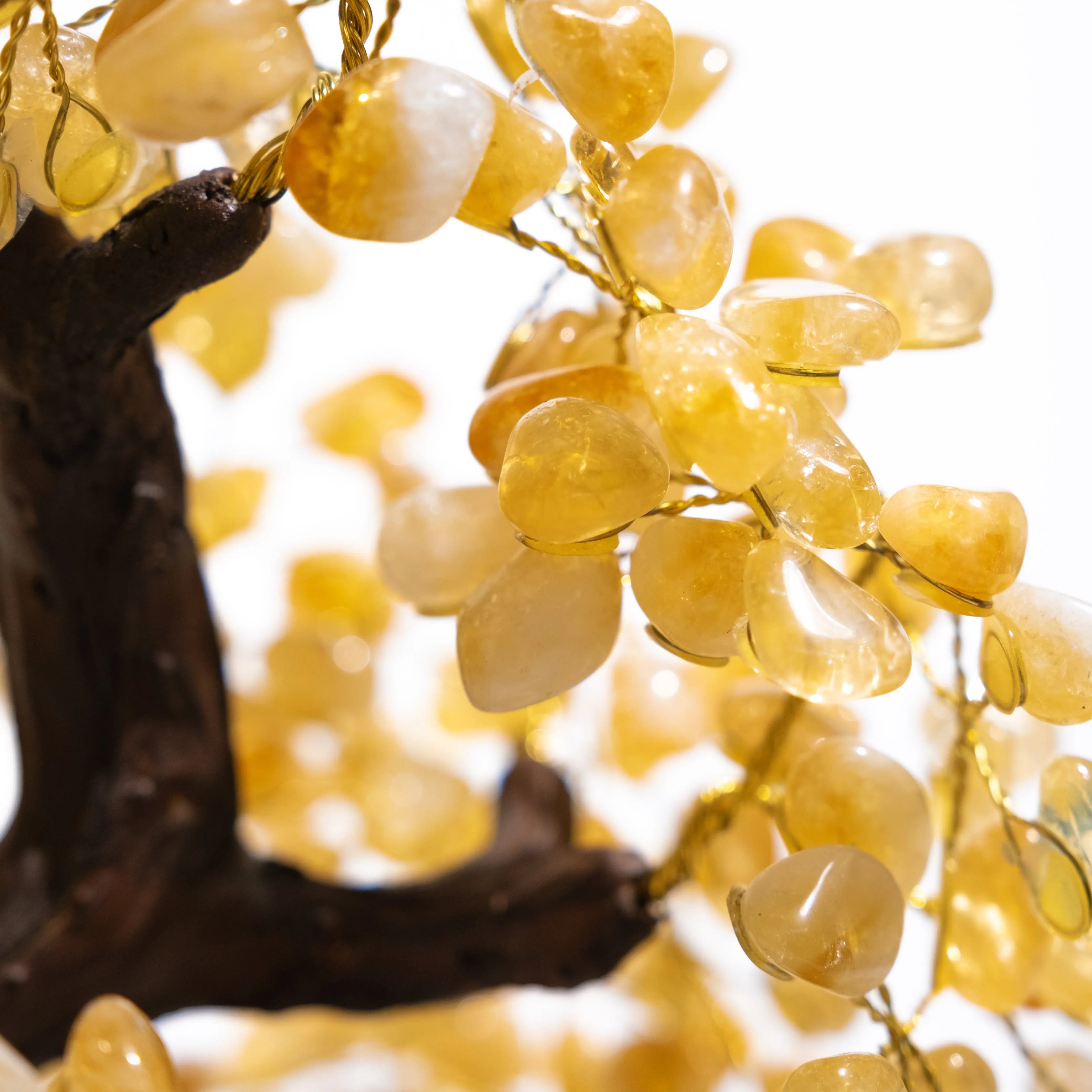 Close-up of a Citrine Crystal Bonsai Tree showcasing tumbled citrine gemstones radiating warmth and positivity on a handcrafted branch.