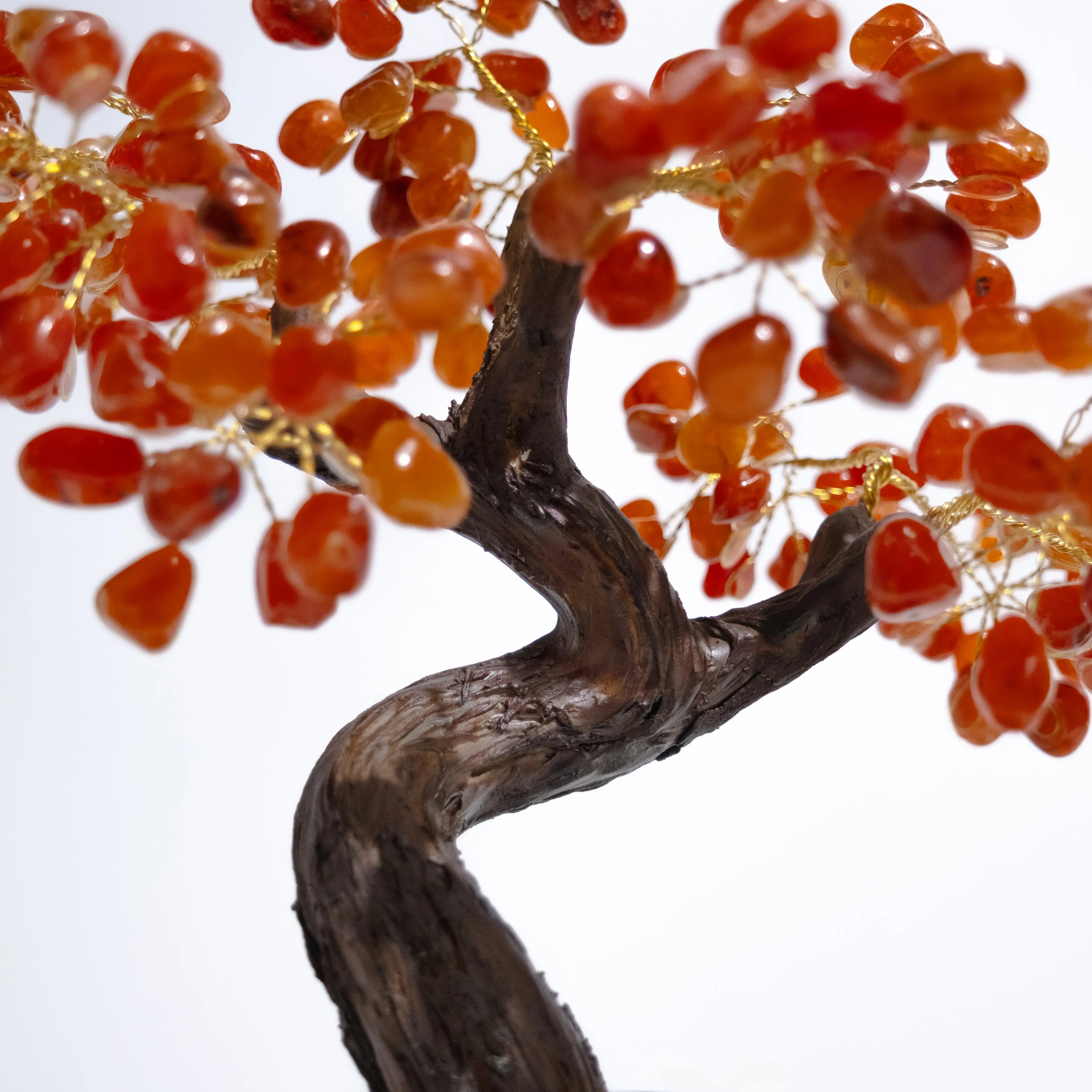 Tumbled Carnelian Bonsai Tree with polished gemstones, promoting creativity and positive energy in home decor.