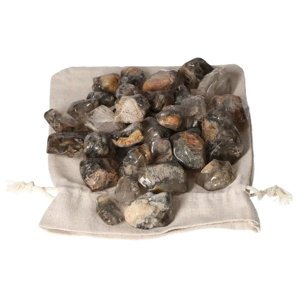 Collection of premium Tumbled Lodolite gemstones from Sylvia Crystals in a drawstring pouch, ideal for spiritual enhancement.