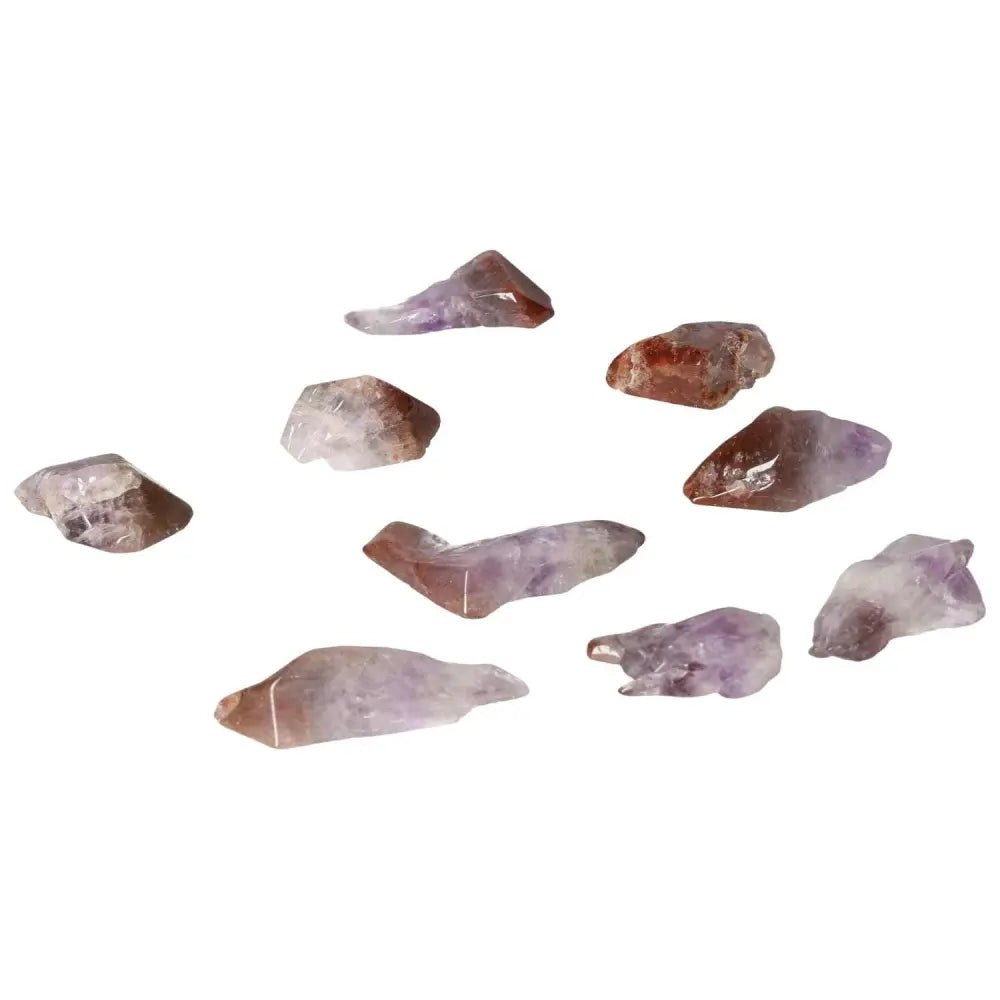 Collection of tumbled point amethyst crystals, known for enhancing emotional stability and elegance, from Sylvia Crystals' premium range.