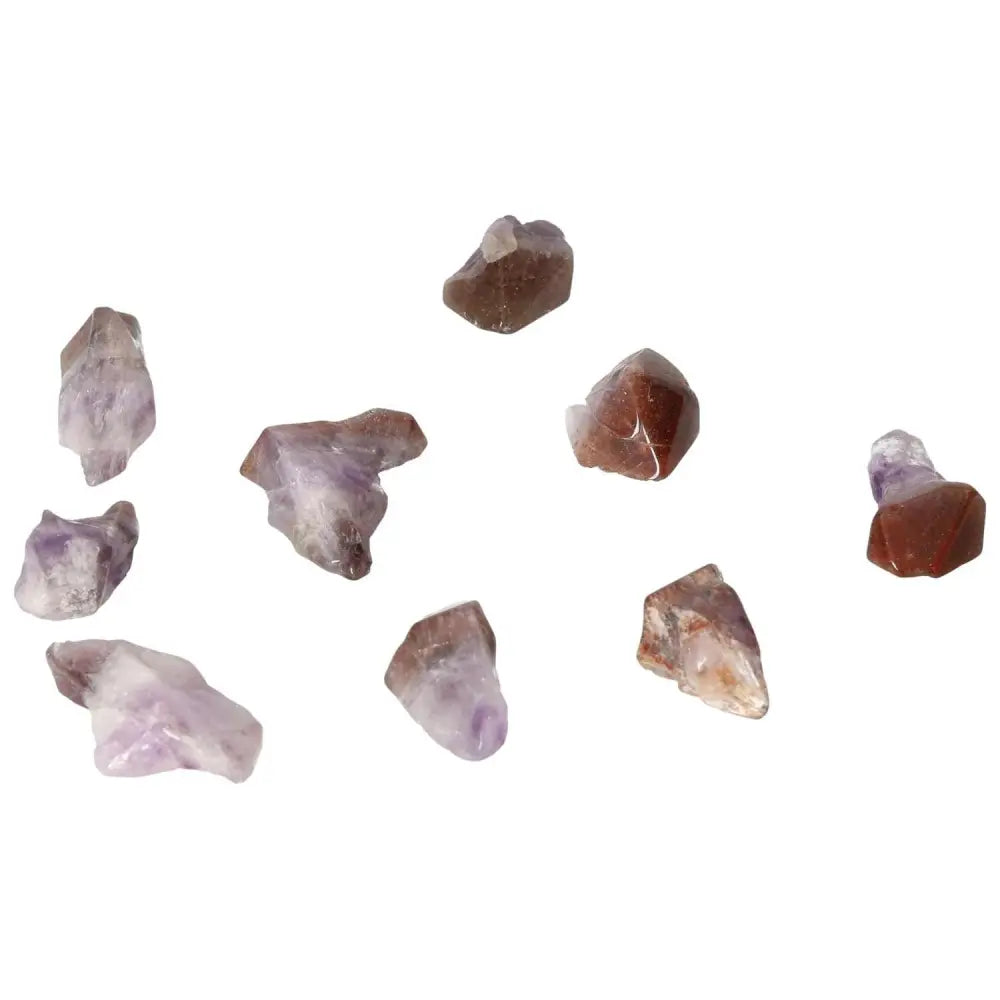 Collection of Tumbled Point Amethyst S crystals, known for enhancing emotional stability and elegance, from Sylvia Crystals.