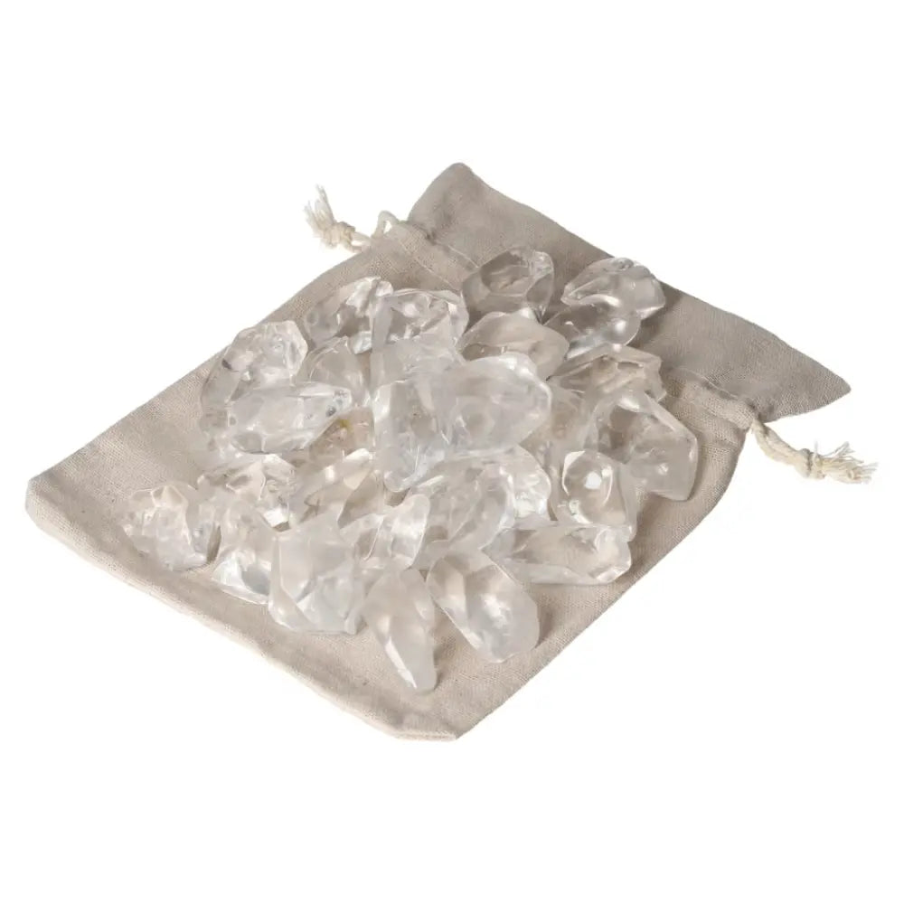 Tumbled Quartz Ice Cubes displayed on a beige cloth bag, offering a luxurious blend of elegance and spirituality from Sylvia Crystals.