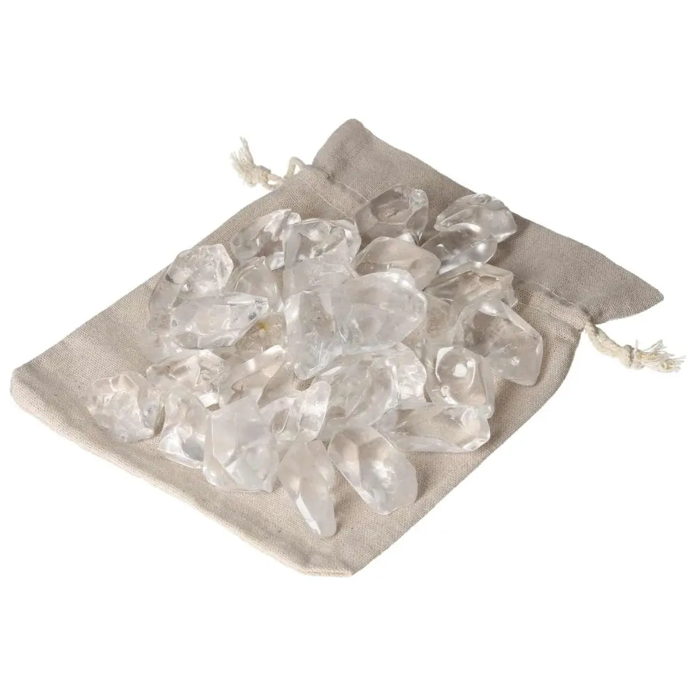 Tumbled Quartz Ice Cubes elegantly placed on a beige fabric pouch, offering a blend of luxury and spiritual enhancement.