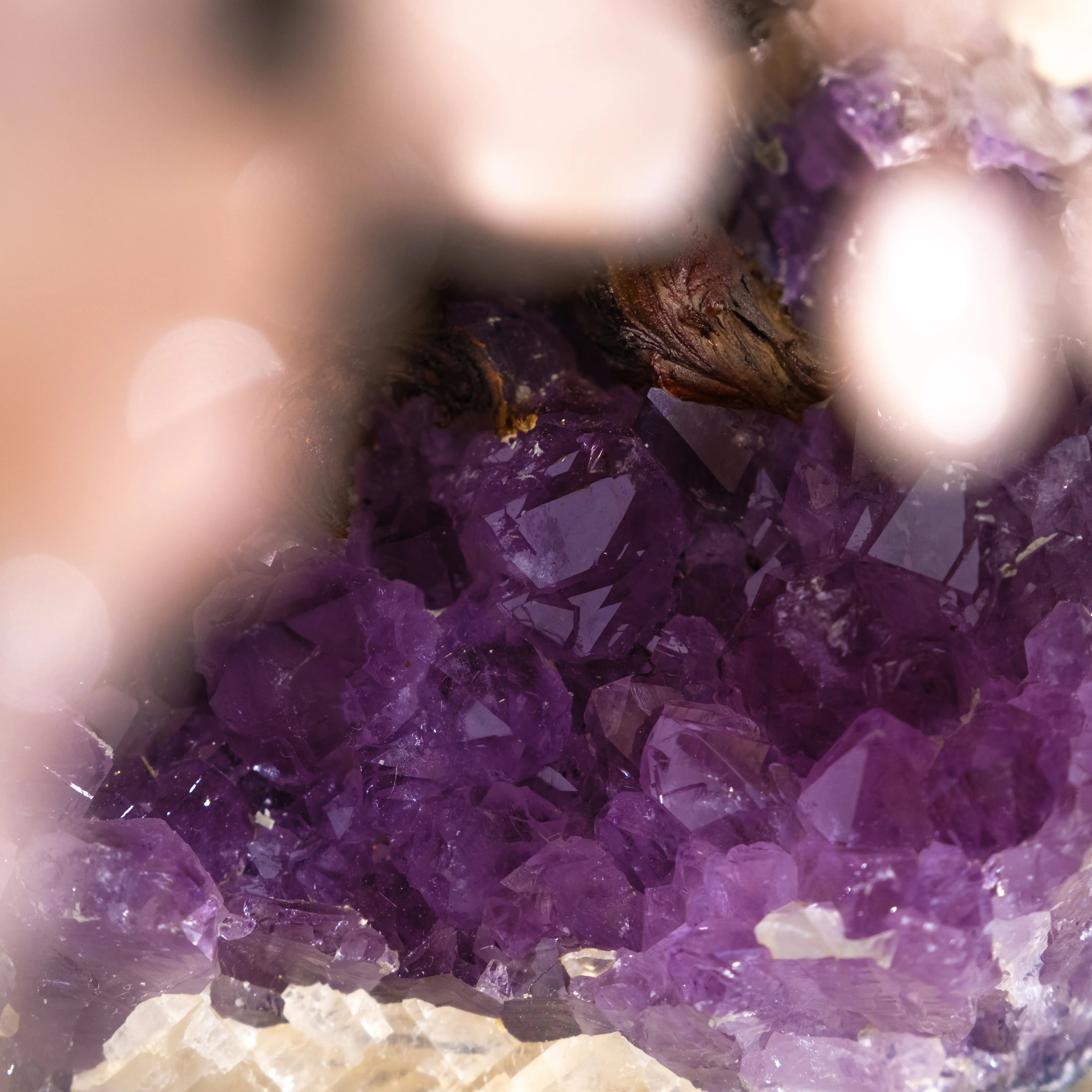 Close-up of vibrant purple quartz crystals glistening, showcasing natural beauty and energy, ideal for enhancing home décor and balance.