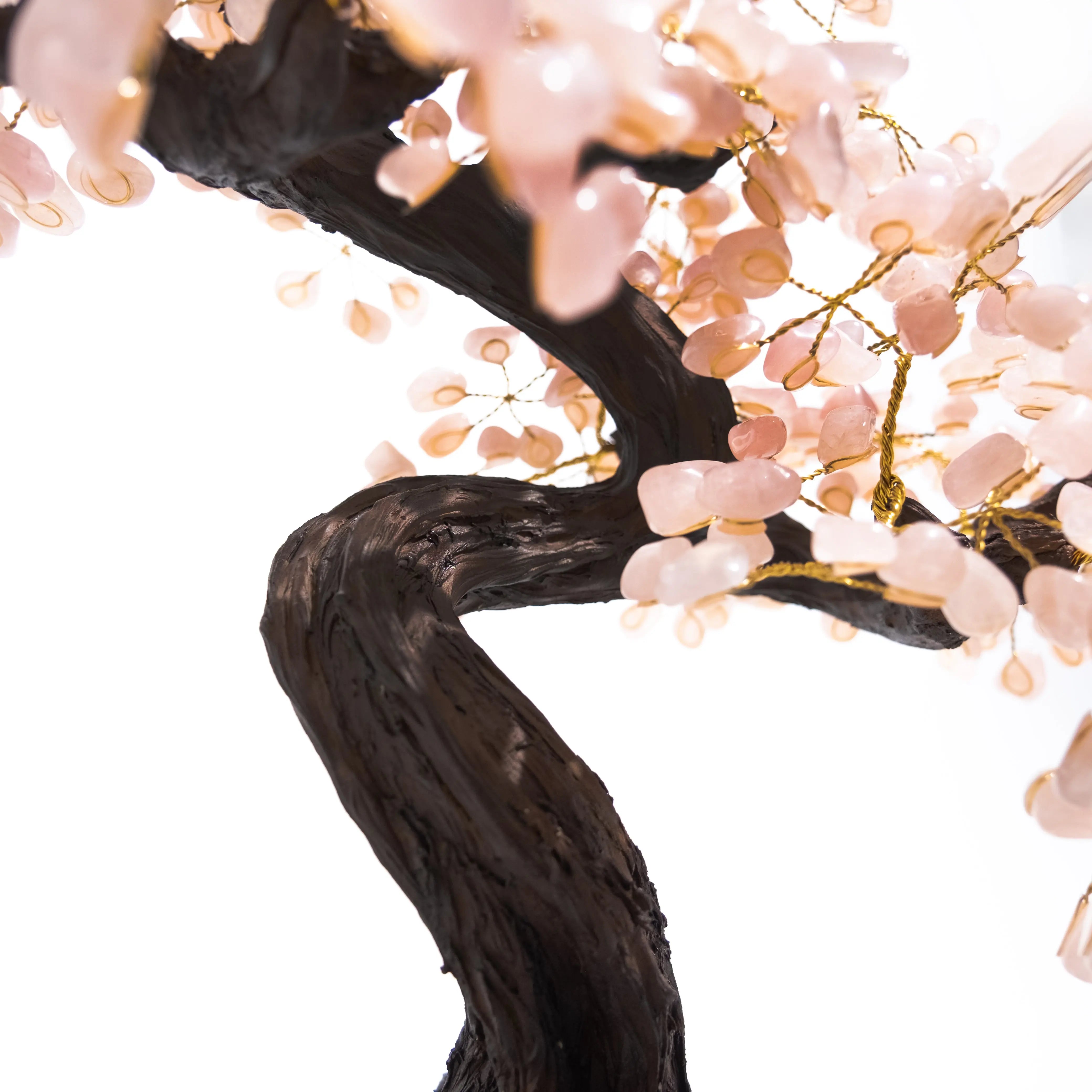 Close-up of a handcrafted wire bonsai with tumbled quartz gemstones, showcasing elegant and natural decorative appeal.