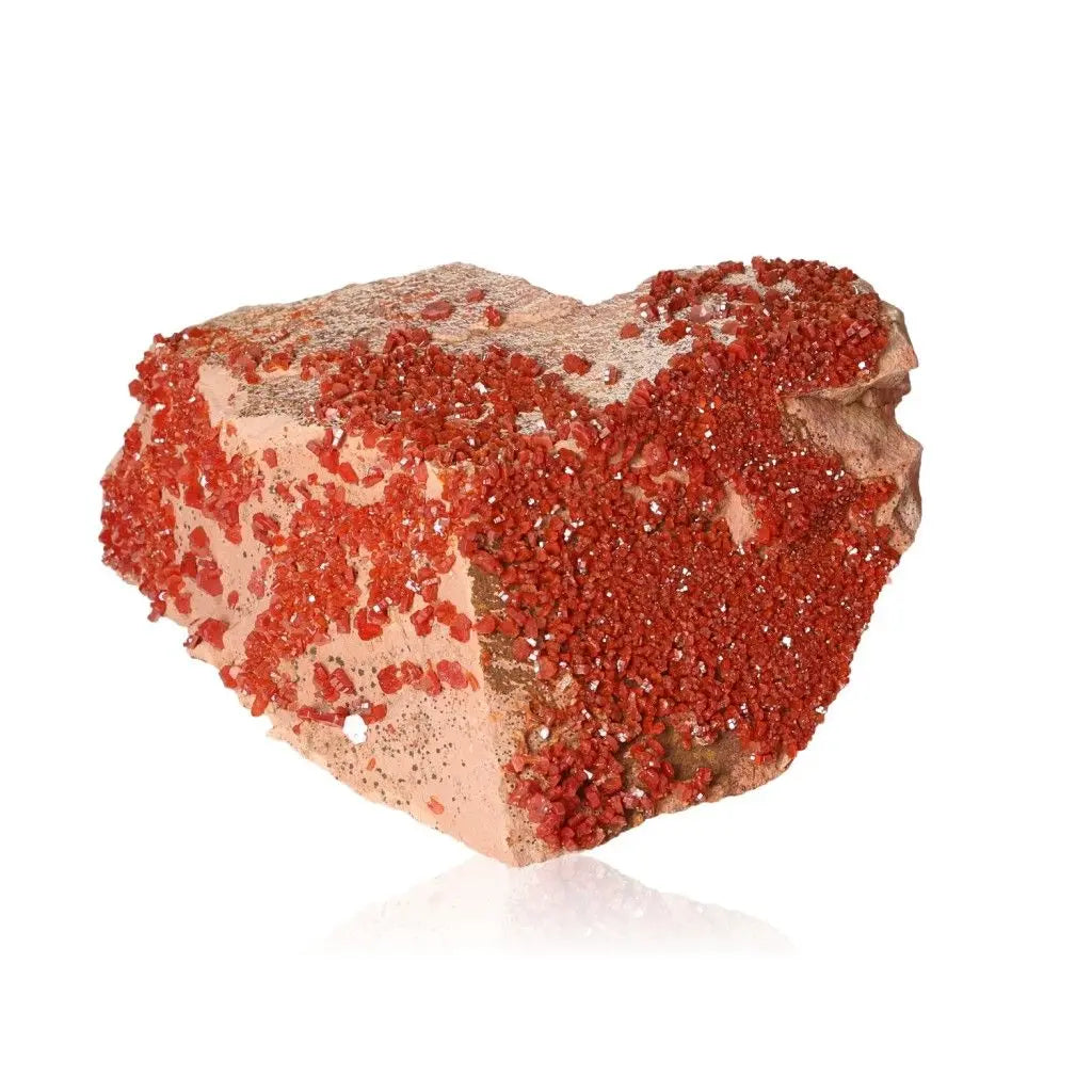 Vibrant Vanadinite Druze showcasing fiery red-orange crystals, ideal for enhancing focus, creativity, and energy in daily life.