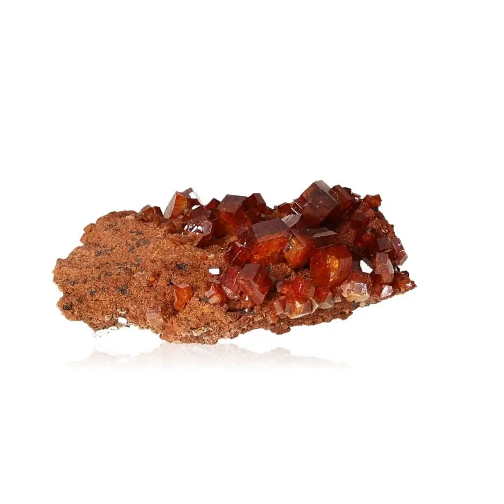 Vanadinite druzy crystal with vibrant red-orange hues, ideal for enhancing focus and creativity.