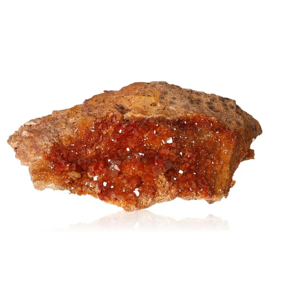 Vibrant Vanadinite Druze showcasing fiery red-orange crystals, known for focus and creativity; perfect for collectors and creatives.
