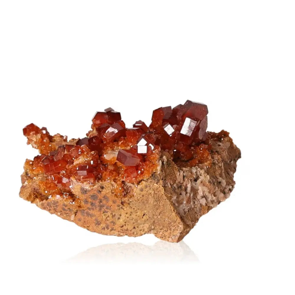 Vibrant red-orange vanadinite druze with unique crystal formations, perfect for focus and creativity enhancement.