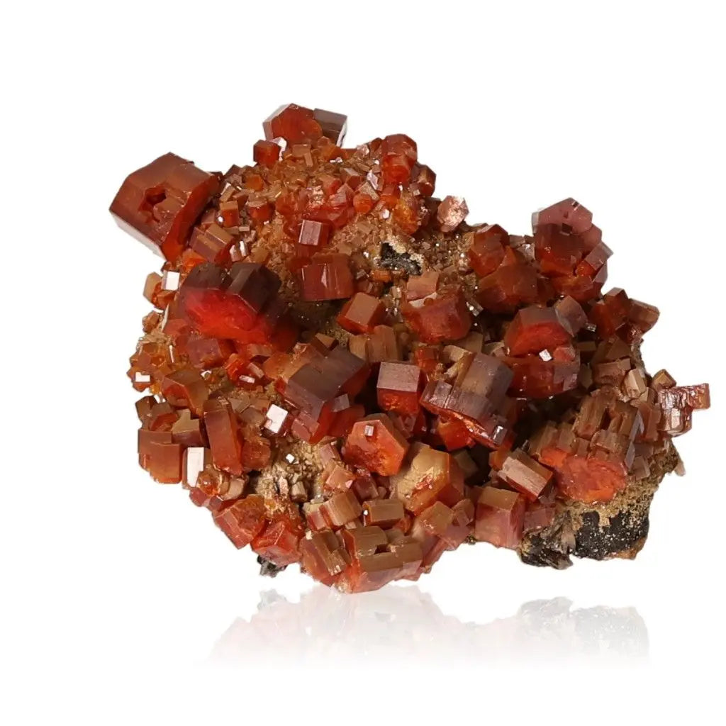 Vibrant red-orange Vanadinite Druze crystal known for focus and creativity, ideal for collectors and enhancing energy and grounding.