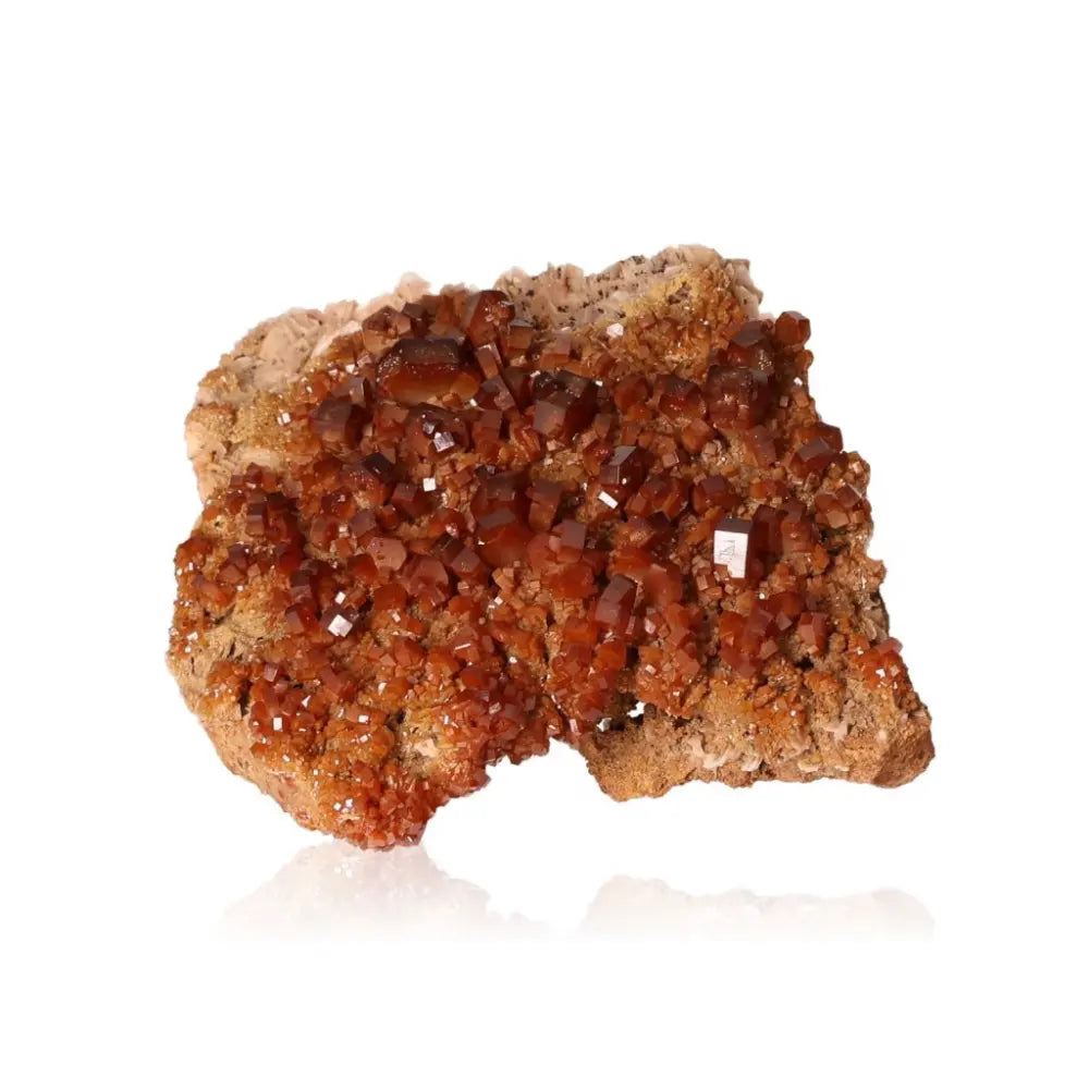 Vibrant red-orange Vanadinite Druze crystal with unique formations for focus and creativity.