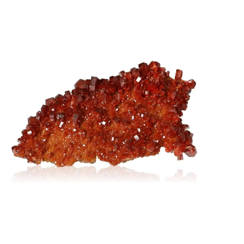 Vibrant red-orange vanadinite druzy crystal for focus and creativity enhancement.