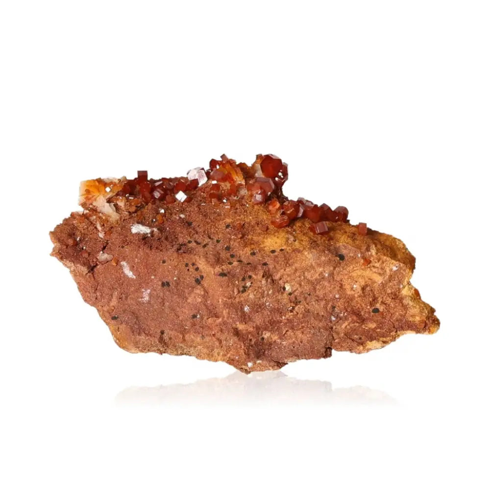 Vanadinite druze crystal displaying vibrant red-orange hues, known for its focus and creativity boosting properties.