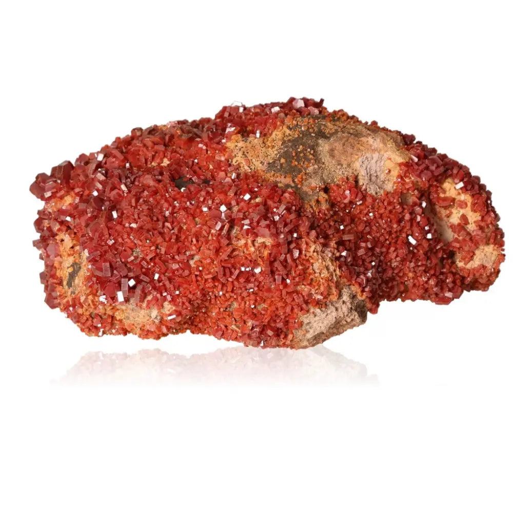 Vibrant red-orange vanadinite druze showcasing unique crystal formations, ideal for focus and creativity enhancement.