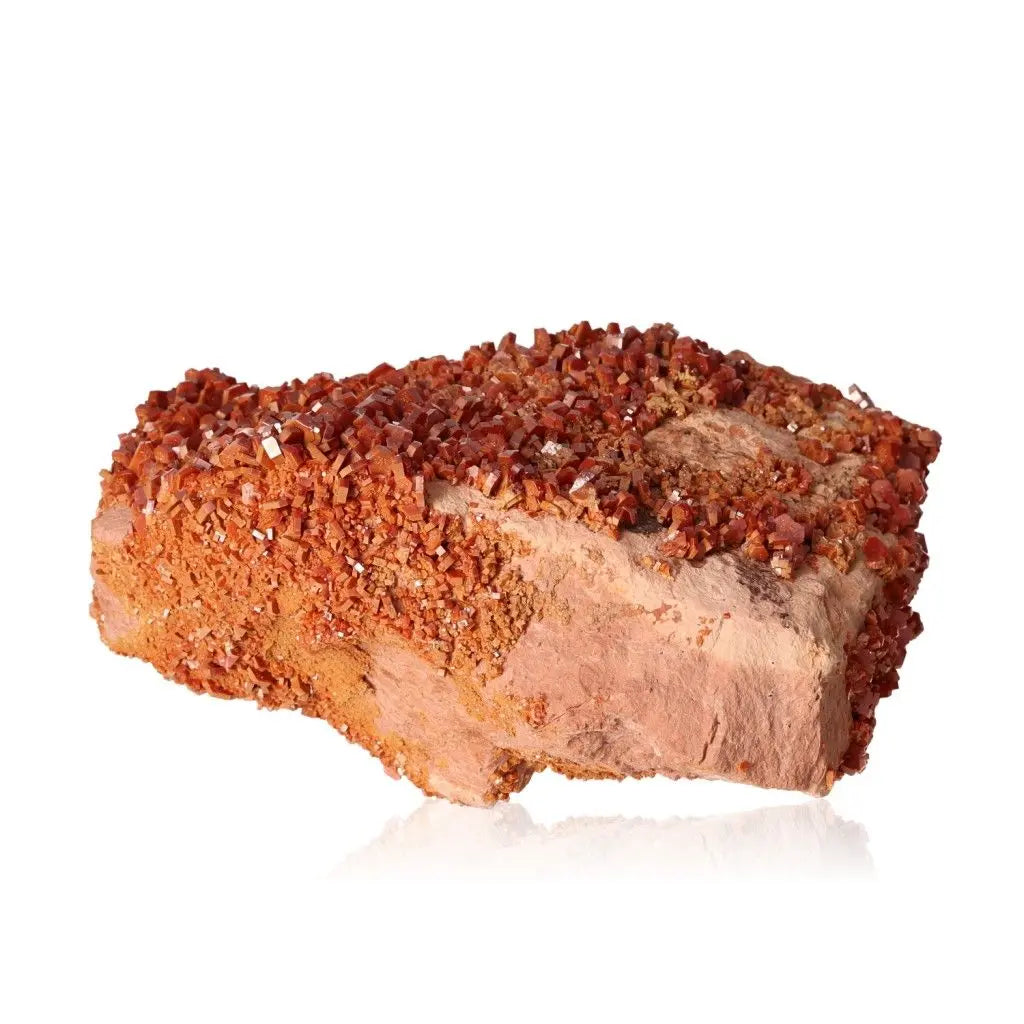 Vibrant Vanadinite druzy crystal with rich red-orange hues, perfect for enhancing focus and creativity in collections.