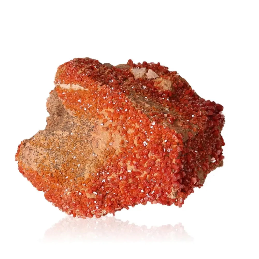 Vanadinite druzy mineral with vibrant red-orange crystals, known for enhancing focus and creativity.
